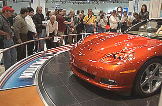 As soon as the L.A. Show opened on Monday the 5th, 100s of Corvette owners and enthusiasts clustered around the C6. Image: Sharkcom As soon as the L.A. Show opened on Monday the 5th, 100s of Corvette owners and enthusiasts clustered around the C6. Image: Sharkcom