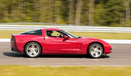 In the center section of turns, because the car was more tail-in at the entrance, a C6 will usually be more stable, especially if the road is bumpy or heaves the car up or down.<br />Image:  Sharkcom
