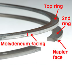 With the rings in simulated position on a piston, you can easily see the hook-like, Napier-faced second ring. 'Napier rings' are much better at scrapping oil off the cylinder walls as the piston moves down and that's the reason GM upgraded to them for 2002.<br />Image:  Author.