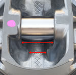 Again, looking at the underside of the piston, to increase strength, the top portion of the wrist pin bore bosses, indicated by the shorter arrows, are wider than the bottom portion.