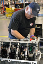 During engine assembly, techniques similar to those used in the engine shops at Katech or Hendrick Motorsports are used to install the pistons, including an awesome ring compressor which the author insists would look excellent in his tool box.