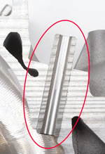 This close-up of a saw-cut, LS7 head shows the part many C6 Z06 owners are nervous about–the valve guide. It's made of powdered steel, is two-inches long, about half an inch in diameter and has an I.D. of a hair over 8-mm.