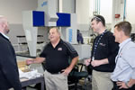 In GM Powertrain's Inspection Department, (R to L) Jeremy Preston, Service Engineering, the Author, Chris Cogan, Cylinder Head Release Engineer and John Rydzewski, Small Block Assistant Chief Engineer, discuss the CMM session run on the set of heads off the <em>CAC</em>'s Z06 project vehicle.