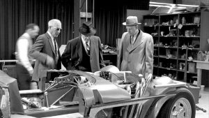 The late Zora Arkus-Duntov, on the left in sunglasses, shows executives the assembly of one of five 1963 Chevrolet Corvette Grand Sport racecars.