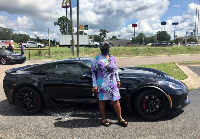 Vanessa Bishop Diggs, 66, stands with her 2019 Chevrolet Corvette Z06 on Aug. 15, 2020.