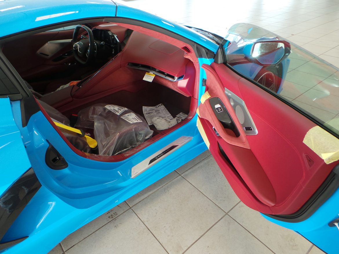 2021 Corvette in Rapid Blue with Morello Red Dipped Interior and Yellow Seat Belts