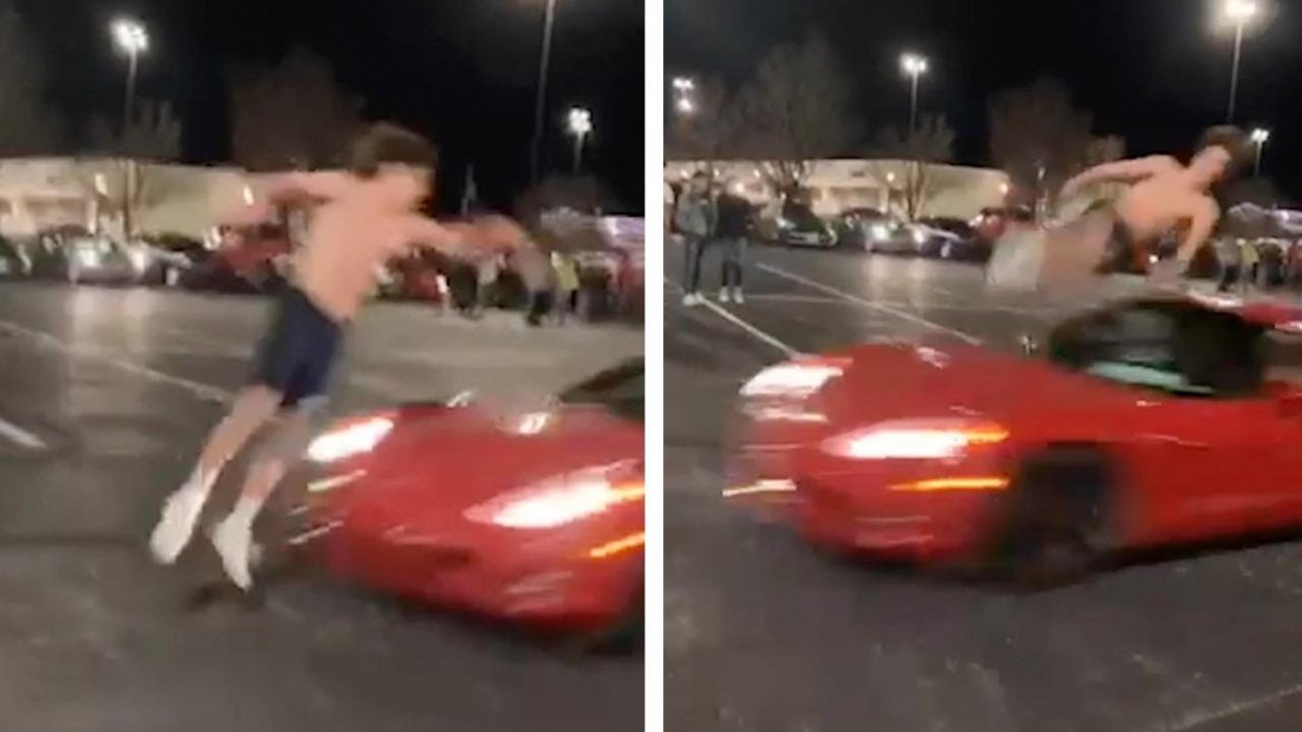 In a car park, many gather to witness Matthew Brown expertly time a flip over a C6 Corvette travelling over 30mph.