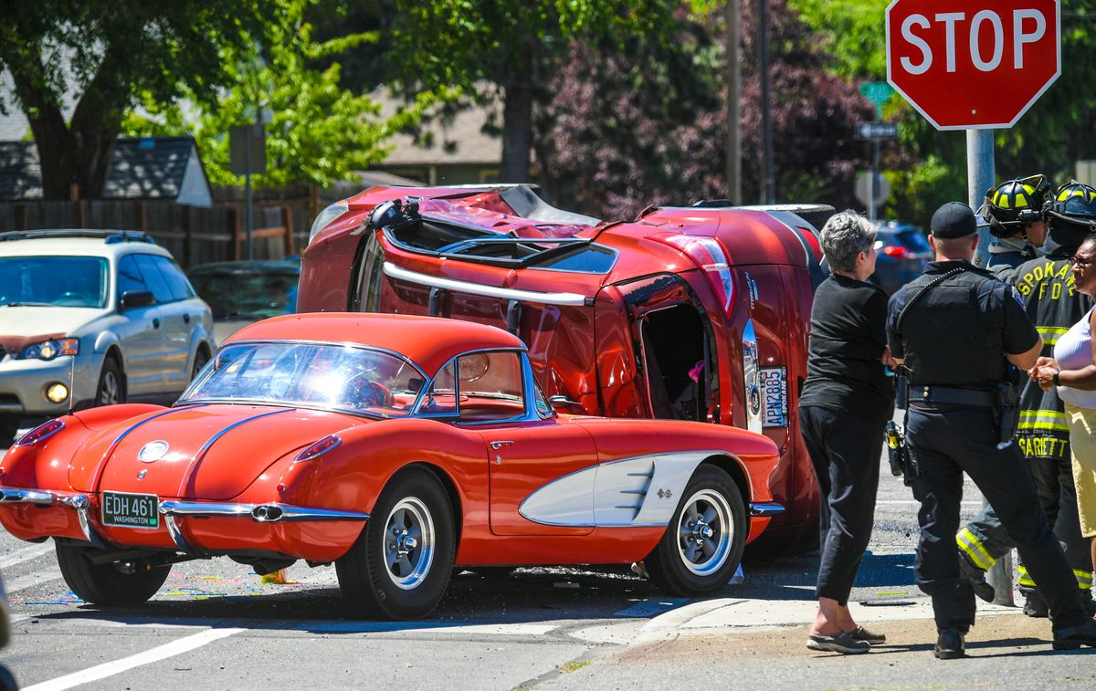 Gary Keyes takes a look at the damage to his restored 1958 Chevy Corvette after a 2014 Ford Escape slid into the classic car Thursday on the corner of Maple Street and Rowan Avenue in Spokane. Keyes had planned to visit a car show in Oregon in two weeks. (DAN PELLE/THE SPOKESMAN-REVIEW)