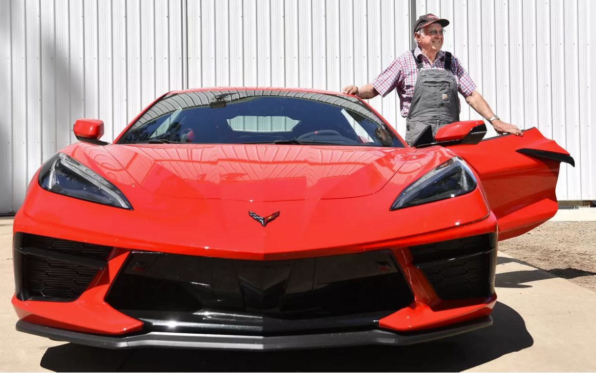 Vern Eden, 87, stands for a photograph with his brand new 2021 C8 Corvette (Tyler Tjomsland/The Spokesman-Review)